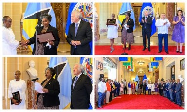 Permanent Representative of St. Lucia to the OAS, Elizabeth Darius-Clarke, at microphone, in black blazer, assumes chair of the Inter-American Council for Integral Development