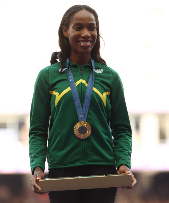 Paris 2024 Olympics - Athletics - Women's Triple Jump Victory Ceremony - Stade de France, Saint-Denis, France - August 04, 2024. Gold medallist Thea Lafond of Dominica celebrates on the podium. 