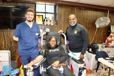 Phlebotomist Jorge Hernandez, from the New York Blood Center, left with repeat donor, Michelle, and NYS Senator Kevin Parker at the 6th Annual Edward Swire Memorial Blood Drive, in collaboration with the Sons of Kings Lodge #123, in Fellowship Hall of Vanderveer Park United Methodist Church, on Sep. 21.