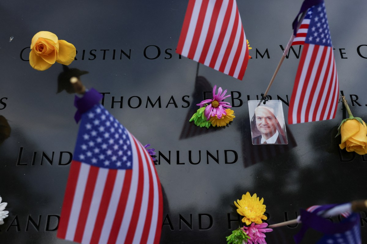 A view shows a picture of a man who passed away during the September 11, 2001 attacks on the World Trade Center, during a ceremony marking the 23rd anniversary of the September 11, 2001 attacks, at the 9/11 Memorial and Museum in the Manhattan borough of New York City, U.S., September 11, 2024.