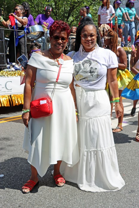 Mother and daughter: "Honoring the Legacy" - Yolanda Lezama Clarke, left, and Leah Clarke Brisard in front of CLACC-C Float.