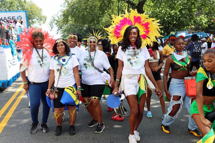 Masqueraders with Chase Float, moving to "Love and Unity.”