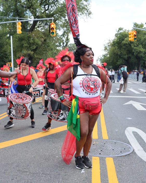 Brazilian Shyla Da Silva leads Batala NY Marching Band.