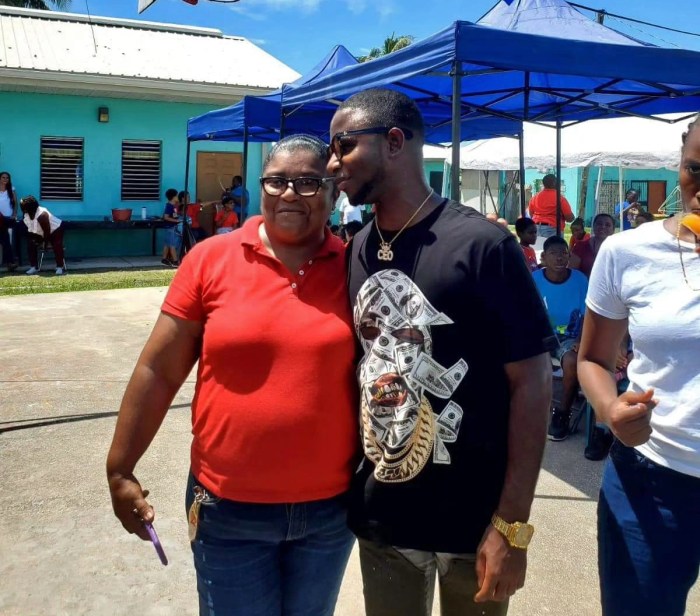 Principal Francella Cantun greets Nigy Boy while visiting Stella Maris in Belize.