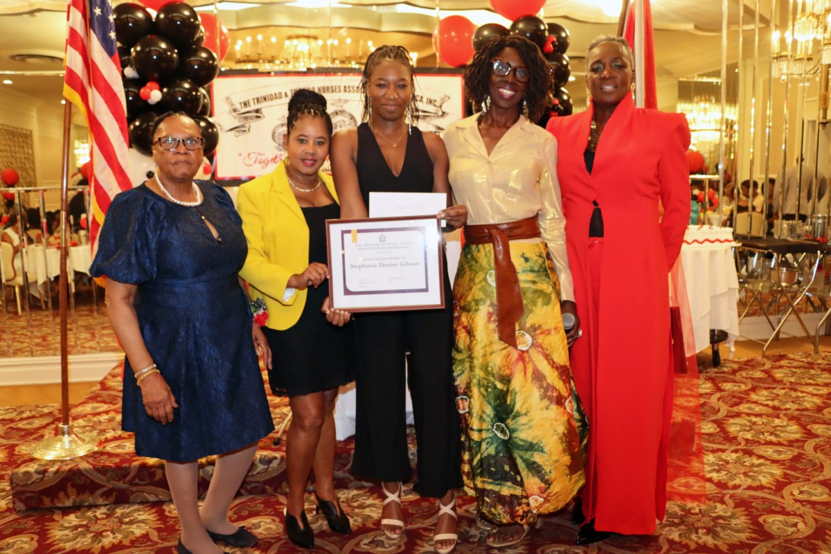 Stephanie Denise Gibson, center, receives an award from retired Justice Sylvia G. Ash to her left, flanked by Naomi Henry, Andrea Dawes, and Dr. Cynthia Sterling-Fox, L-R.