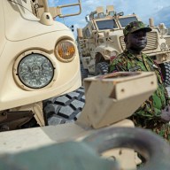 A Kenyan member of the Multinational Security Support Mission (MSS) stands next to a Maxxpro Mine Resistant Ambush Protected Vehicle before US Secretary of State Antony Blinken arrived for a meeting at the base in Port Au Prince, Haiti on Sept. 05, 2024