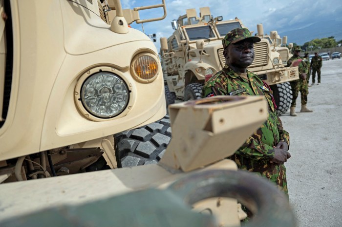 A Kenyan member of the Multinational Security Support Mission (MSS) stands next to a Maxxpro Mine Resistant Ambush Protected Vehicle before US Secretary of State Antony Blinken arrived for a meeting at the base in Port Au Prince, Haiti on Sept. 05, 2024