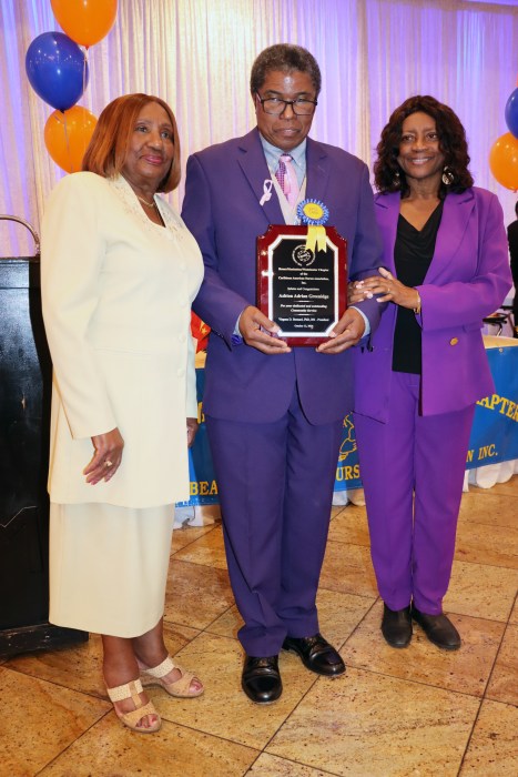 Barbadian-born Aston Greenidge receives the Community Service Award from CANA/BMW Chapter Dr. Virginia Bernard, RN, left, and Greenidge's wife, Dr. Christine Greenidge, RN.