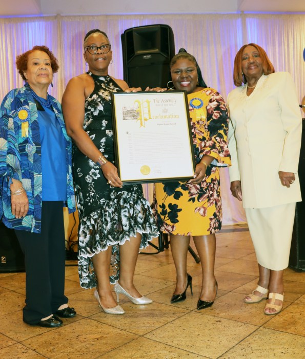 Dahniel Samuel, RN, second from right, receives proclamation on behalf of her late mother, RN Hopina Samuel, flanked by, from left to right: Brenda Youmans, RN, Dawn Africa, DNP, RN, and Dr. Virginia Bernard, RN.