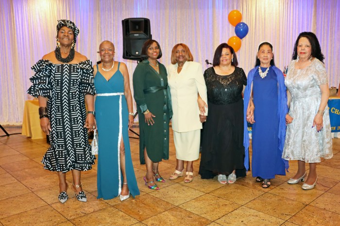 Models pose with Dr. Virginia Bernard, RN, center, after strutting their stuff.