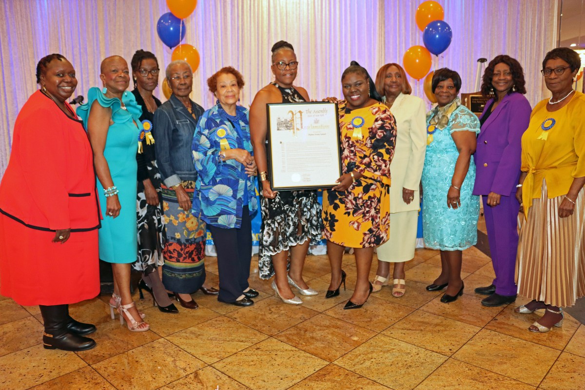 CANA/BMW Chapter members pose with a proclamation held by Dawn Africa, DNP, RN, sixth from left, and Dahniel Samuel.