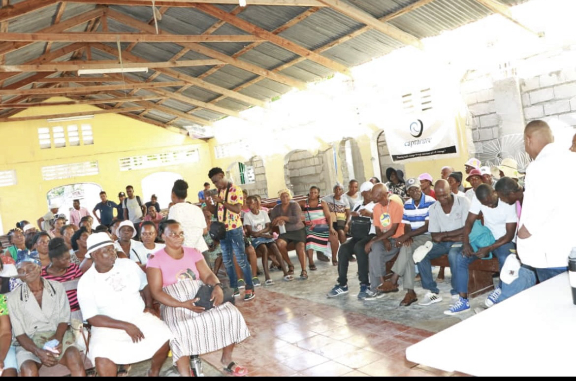 Residents of Les Cayes, Haiti, seeking medical care at a clinic organized by capracare.