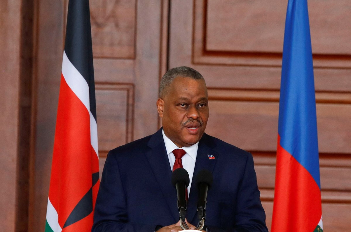 Haitian Prime Minister Garry Conille speaks during a joint press conference with Kenya's President William Ruto during his visit to the State House in Nairobi, Kenya, Oct.