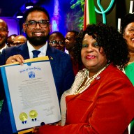 President Ali smiles brightly as he is presented with a New Jersey Resolution from Senator Britnee Timberlake of the 34th District from Lady Ira Lewis, president of the Guyana American Heritage Foundation, NJ. Senator Jabari Brisport is at the extreme left, and Assembly Member Alicia Hyndman is at the extreme right. Both of Guyanese parentage, at a breakfast morning at Waterfall Lounge, Brooklyn.