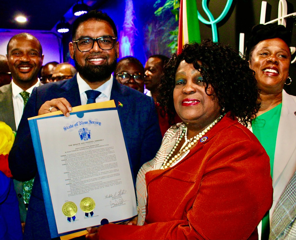 President Ali smiles brightly as he is presented with a New Jersey Resolution from Senator Britnee Timberlake of the 34th District from Lady Ira Lewis, president of the Guyana American Heritage Foundation, NJ. Senator Jabari Brisport is at the extreme left, and Assembly Member Alicia Hyndman is at the extreme right. Both of Guyanese parentage, at a breakfast morning at Waterfall Lounge, Brooklyn.