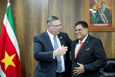 TotalEnergies CEO Patrick Pouyanne and Suriname's President Chan Santokhi embrace after France's TotalEnergies and U.S. APA Corp announced a positive investment decision for Suriname's most promising oil and gas project, Block 58, which is expected to inaugurate the nation's offshore output, in Paramaribo, Suriname Oct. 1, 2024.