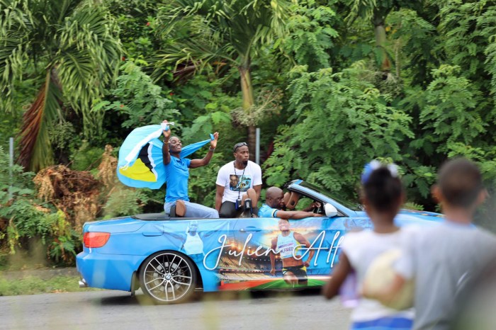 Saint Lucia appoints the World’s Fastest Woman, Julien Alfred as Tourism Ambassador. She can be seen here waving to the crowd during a welcoming parade.