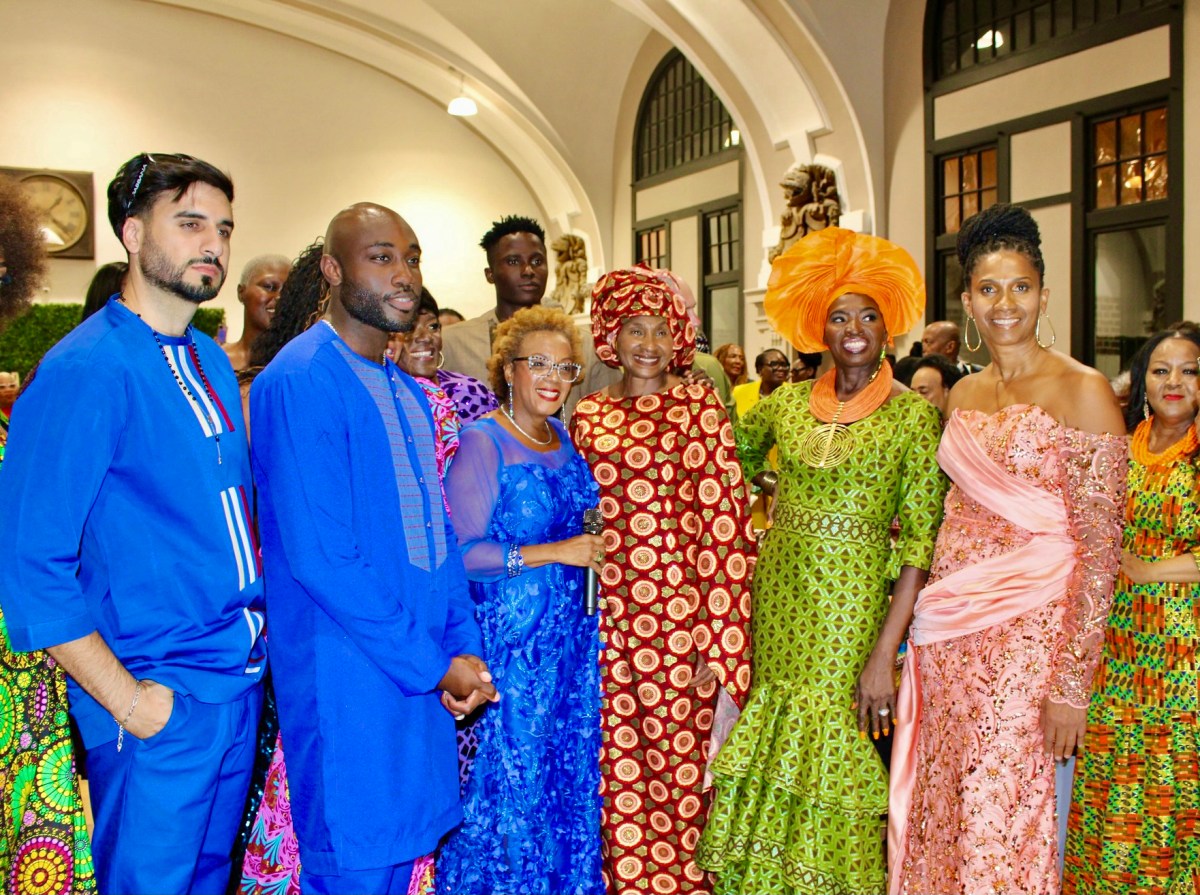 Nigerian-born, Nonya Anyadiegwu, creator of Noni Styles put on an exceptional 11th Annual fashion show at Major Owens Community Center, male models, left with emcee Sharon Gordon, and Nonya, fourth from left and other models wearing her designs.