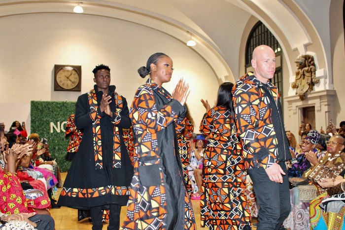 Fall coats in color-blocking patterns, cut from mud cloth, are being showcased by models on the Noni Styles runway.