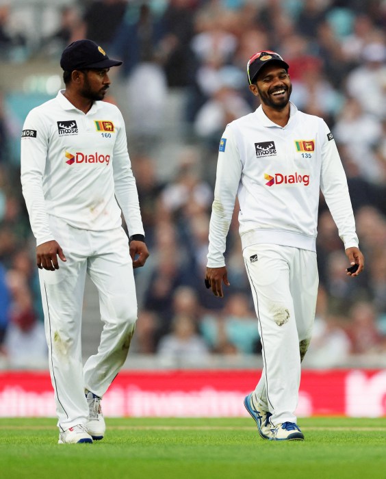 Sri Lanka's Dhananjaya de Silva and Prabath Jayasuriya as the match against England gets suspended due to bad light at The Oval, London, Britain, Sept. 6, 2024.