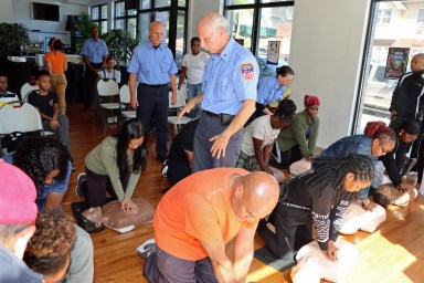 Participants practicing CPR.