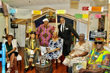 Yesterday's Children at the 14th Annual Salute, from left are Norma Clarke, Guyana, Samuel Farrell, Jacqueline Ifill, Elaine Granderson, and Duff Mitchell, Trinidad & Tobago, photographed with the Founder of Yesterday's Children Inc. Glenda Cadogan, and Senator Kevin Parker standing.