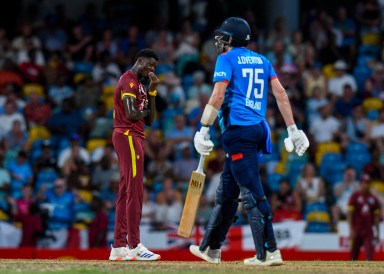 Alzarri Joseph (L) of West Indies express disappointment after Jamie Overton (R) of England hits 4 during the 3rd and final ODI match between West Indies and England at Kensington Oval, Bridgetown, Barbados, on Nov. 6, 2024.