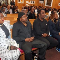 In front pew: Cecille "Peggy" White's daughter Candance Blair, left, and first son, Jason, second from left, with mourners.