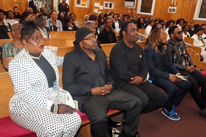 In front pew: Cecille "Peggy" White's daughter Candance Blair, left, and first son, Jason, second from left, with mourners.