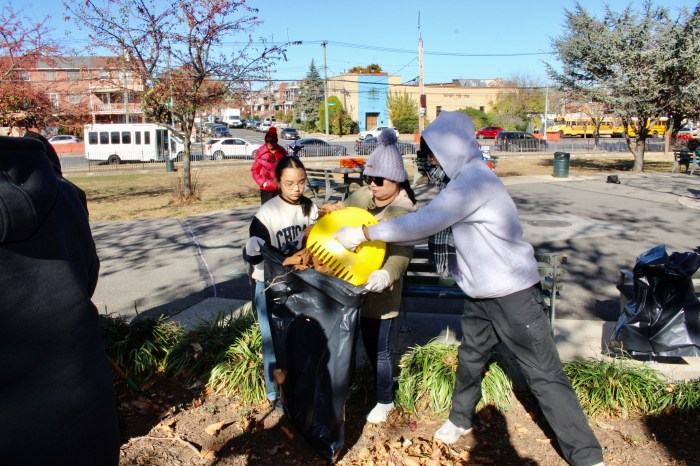 Helpers bagging fallen leaves before planting flowering bulbs at the annual beautification initiative for a colorful spring bloom in Canarsie Park, Brooklyn, last Saturday.