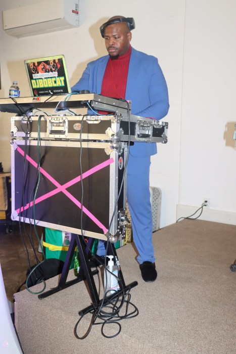 Grenadian-born DJ Bob Cat provides Caribbean music at the event.