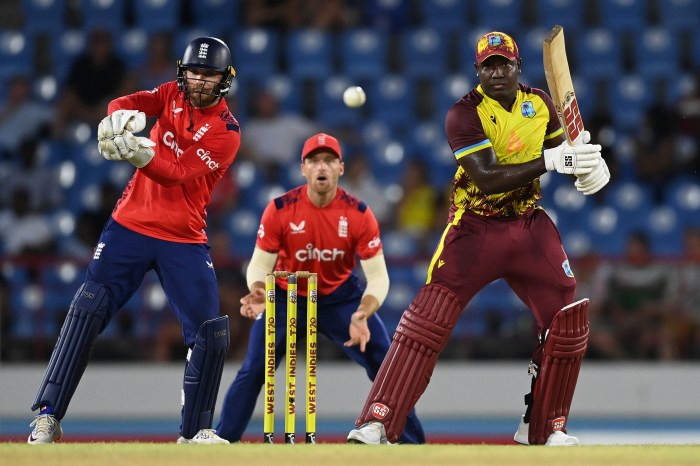 Rovman Powell of the West Indies bats watched by England wicketkeeper Phil Salt during the 3rd International t20 between the West Indies and England at Daren Sammy National Cricket Stadium on November 14, 2024 in Gros Islet, Saint Lucia.