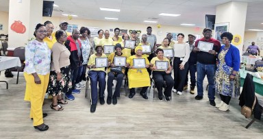 Participants display their certificates at the Sundance Livonia. Dr. Janice McLean, president of APC is at left with Hanna Liriano-(DOH Clinical Community Linkage Project Manager) at right.