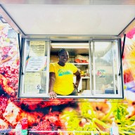 Kimbesha Campbell stands proudly at one of her outdoor events, serving from her food truck.