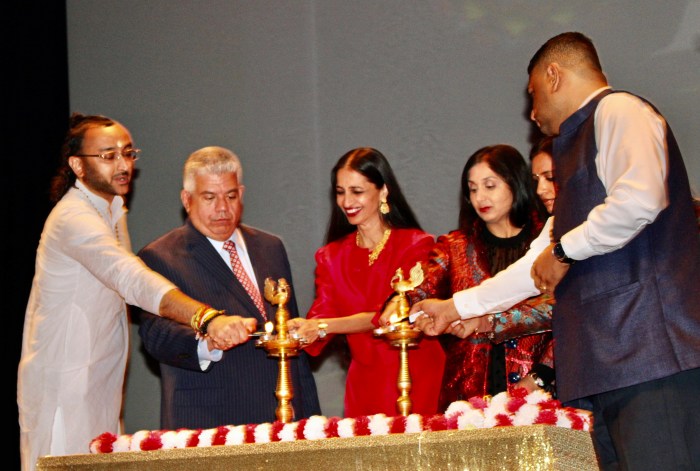 Brooklyn District Attorney, Eric Gonzalez, second from left, joins honorees Senior Priest - Spiritual Leader Bhuvaneshwar Mandir, Inc, Acharya Arun Gossai, Acting Justice, Supreme Court, Hon. Raja Rajeswari, Executive Director, Sakhi for South Asian Survivors, Kavita Mehra, and guests lighting the Diya to commemorate the Second Diwali event organized by the DA's office on Oct. 23, at NYC College of Technology, in Brooklyn.