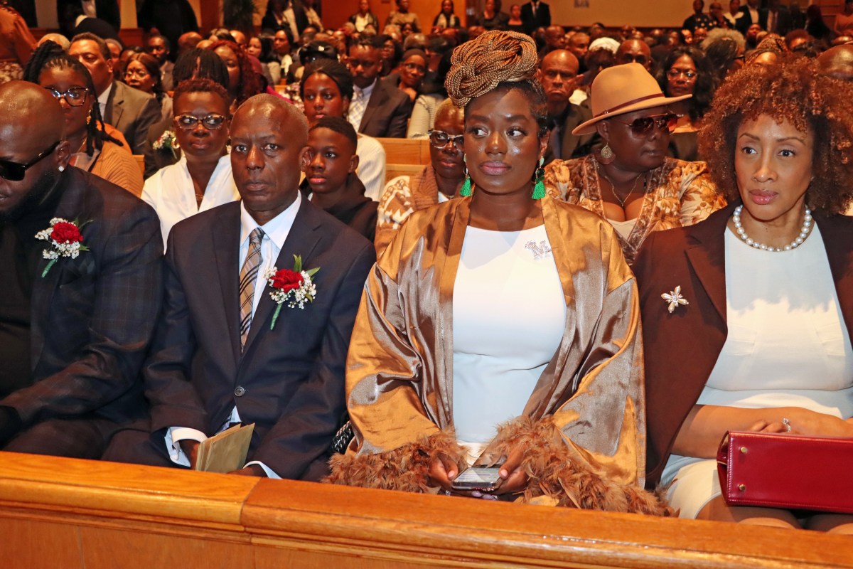 The Beaton Family in front pew: Husband Douglas Beaton, second from left, with son Kevin to his right; daughter Denica to his immediate left; and Minerva's sister-in-law, Joy MGowan, right, who is married to Minerva's brother, Neil McGowan.