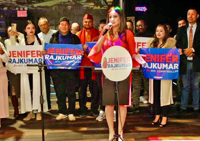 Candidate for NYC Comptroller Jenifer Rajkumar addressing supporters, some holding placards, during a kickoff campaign on Nov. 21 at the Palace in Woodside.