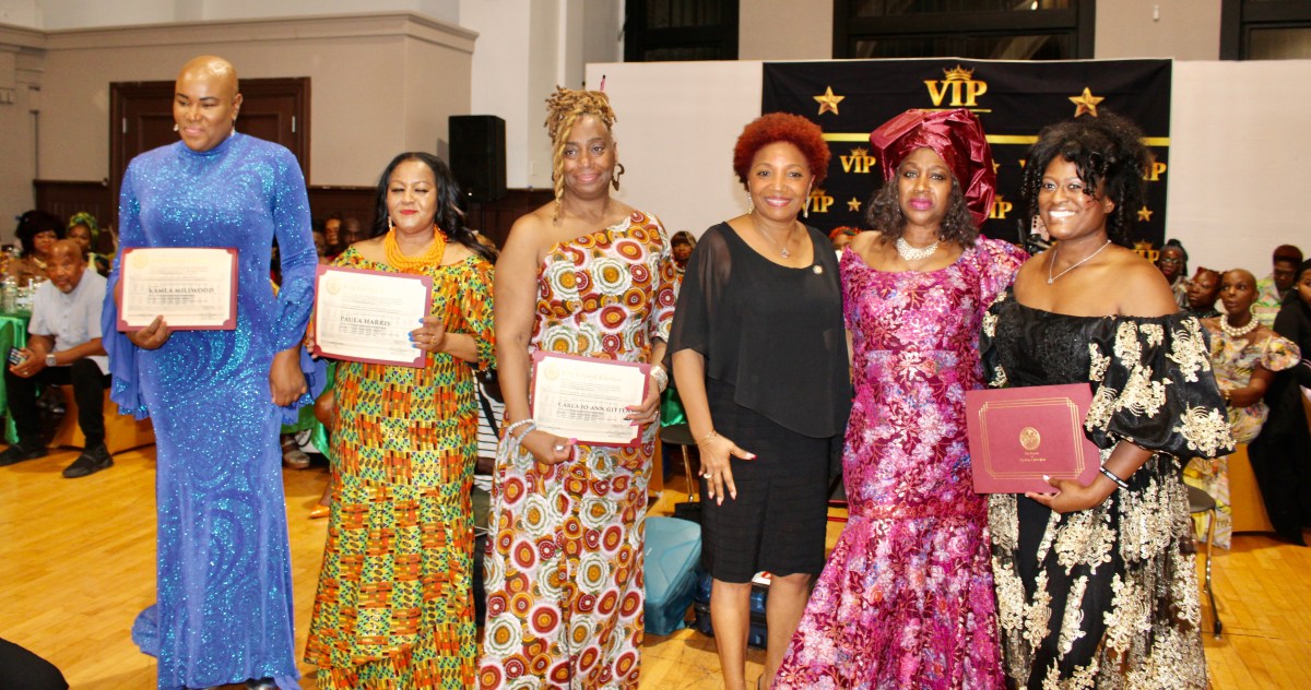 A group of beautifully dressed women were honored at the 11th Annual Noni Styles runway event on Oct. 12 at the Major Owens Center in Brooklyn. From left are Kamla Millwood, Paula Harris, and Karla Jo-Ann Gittens. NYC Council Member Mercedes Narcisse, fourth from left, joins Venice Anderson and Violinist Dr. Melanie R. Hill for the photo-op.