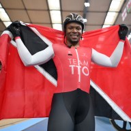 Nicholas Paul of Team Trinidad And Tobago celebrates with their flag after winning Gold during the Men's Track Cycling Keirin Final on day two of the Birmingham 2022 Commonwealth Games at Lee Valley Velopark Velodrome on July 30, 2022 on the London, England.