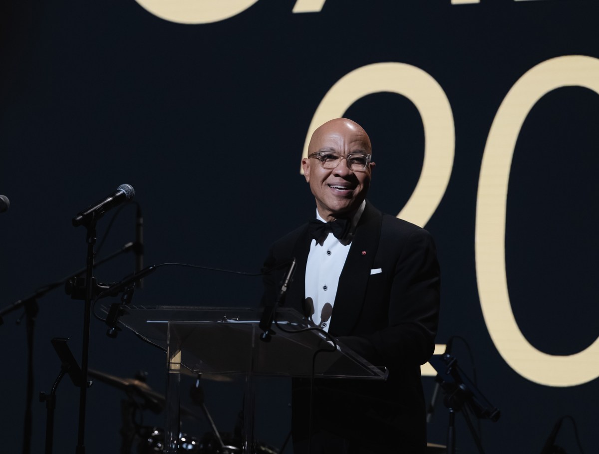 Ford Foundation's President, Darren Walker, is at the podium.