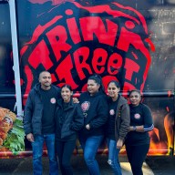 Tiffani Sahai, owner of Trini Street Food (second from left) with her team.