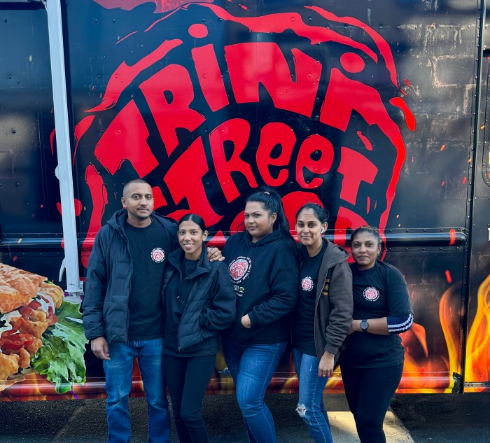 Tiffani Sahai, owner of Trini Street Food (second from left) with her team.