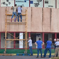 Workers protect a facility ahead of the arrival of tropical storm Rafael in Havana on November 5, 2024. Cuba was bracing for Tropical Storm Rafael, which is expected to make landfall on the island as a hurricane on Nov. 6, compounding the misery wrought by a massive blackout and Hurricane Oscar.