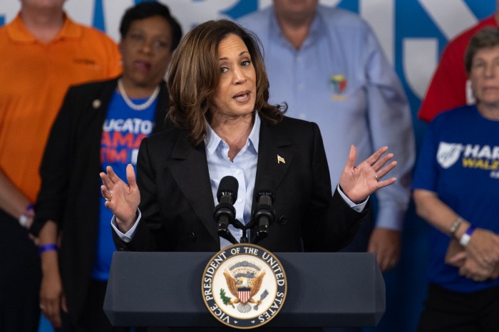 Flanked by labor union leaders, Democratic presidential candidate Vice President Kamala Harris speaks to union workers during a campaign event on Sept. 02, 2024, at Northwestern High School in Detroit, Michigan. 