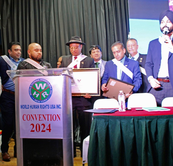 Officials at the WHRUSA 2nd Convention on October 19 at the Queens Palace, from left Saghir Khan, Assembly Member Steven B. Raga, President Dr. Rafiqul Islam, two guests, (back row) Suffolk County Legislature Sam Gonzalez, and Japneet Singh, Office of Public Advocate Jumaane Williams.