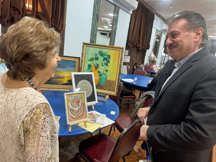 Senator Addabbo speaks with artist Carol Zarookian Anastasian.