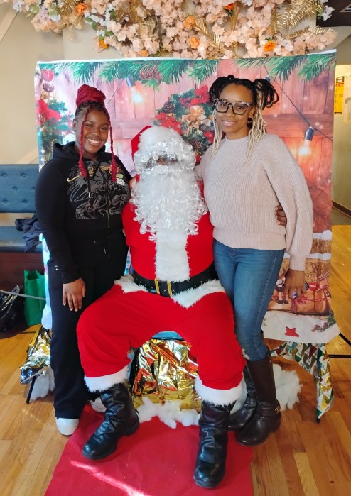 Brooklyn residents pose with Santa.