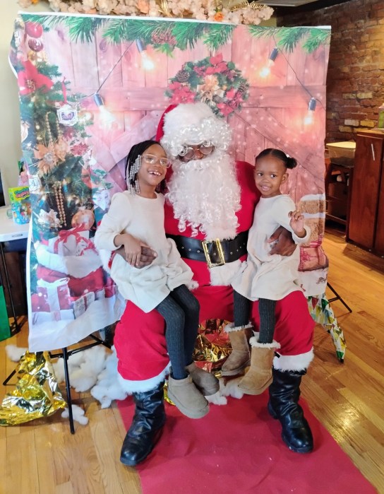 Kids pose with Santa.