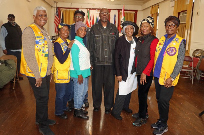 Members of the New Horizon Lions Club with Myrthland Ince, center, and Orlando Maxwell (back).