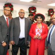 Communications Officer of the Jamaica Consulate, Christopher Benjamin, left, a guest, CG Michael E. Brotherson, CG Alison Wilson, and Sheldon Peter Anthony, Consul General of Dominica, during a festive social at the Manhattan Consulate on Dec. 18.